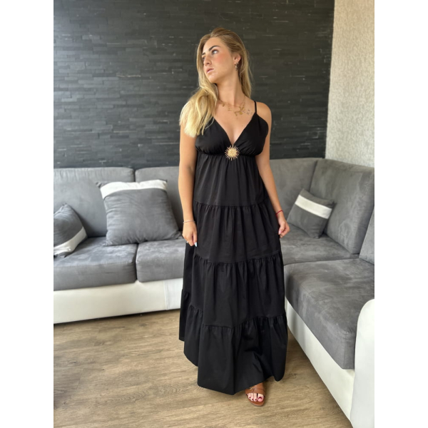 Robe longue noire avec broche soleil